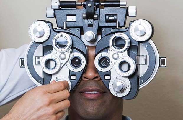 Doctor checking person's vision